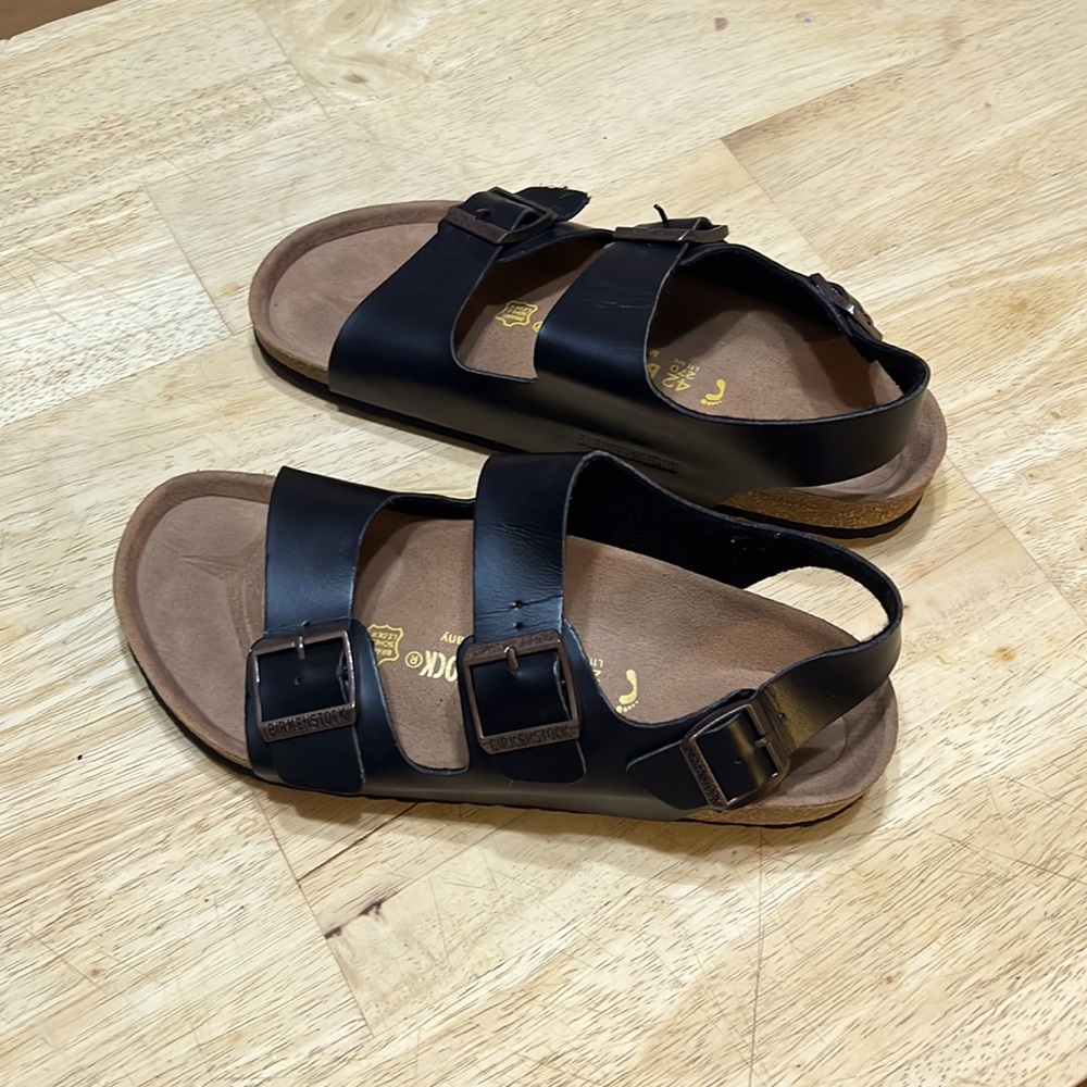 Black leather Birkenstocks with back-strap